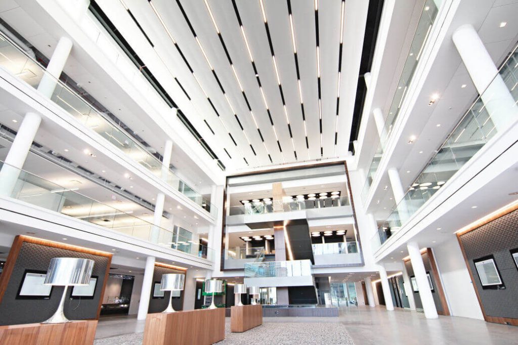 High-end finishes at Mercedes Benz headquarters in Atlanta included acoustical, GFRG columns, torsion spring ceilings, stretch fabric ceilings, tectum ceiling panels, wall protection, FRP, and plaster