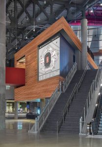 Interior staircases and wood-paneled feature wall at State Farm Arena in Atlanta, GA
