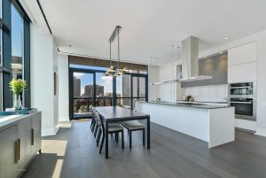 Inside model apartment home at 400 W Huron which features gourmet kitchens and floor-to-ceiling windows with city views
